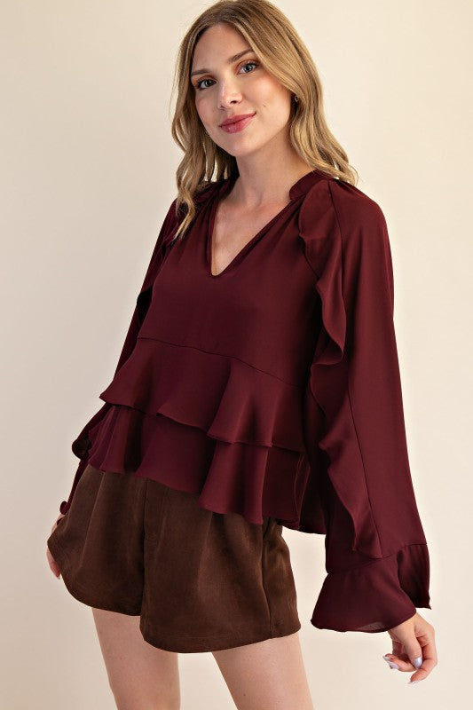 Blusa vino con olanes manga larga