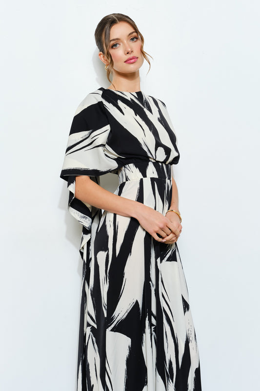Jumpsuit sin mangas estampado abstracto con cuello de bufanda y drapeado